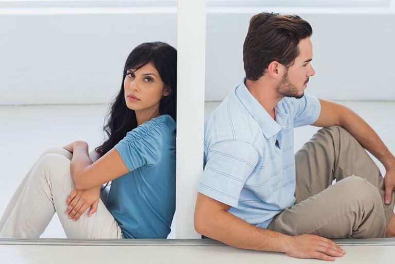 unhappy couple sitting apart