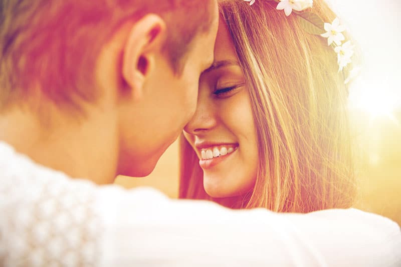 beautiful woman hugging with man