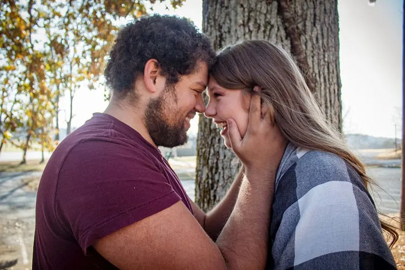 sweet couple doing a forehead to forehead