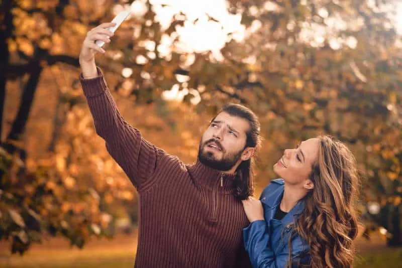 couple taking selfie outside