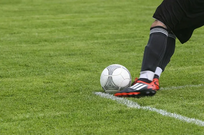 field-grass-sport-foot-kicking a ball