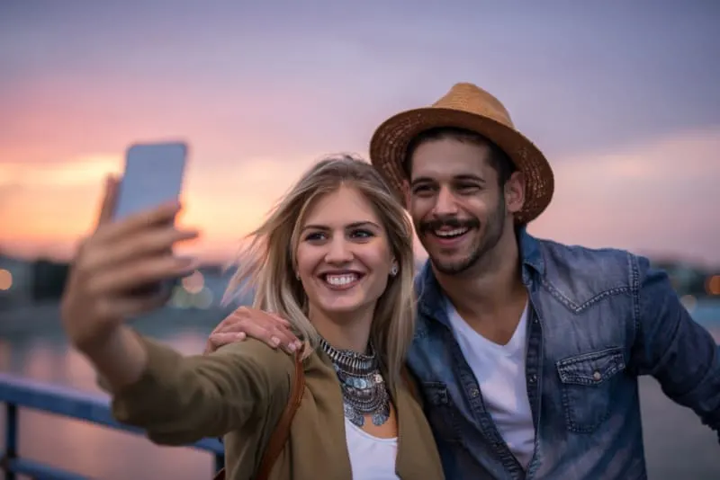 happy couple making selfie