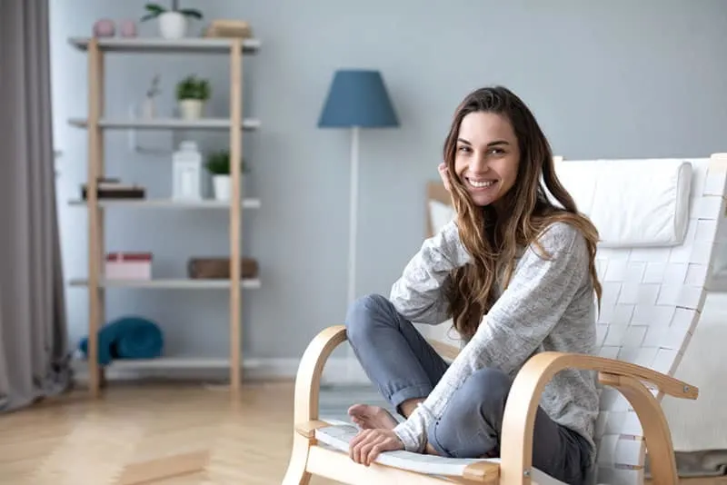 happy woman sitting on chair