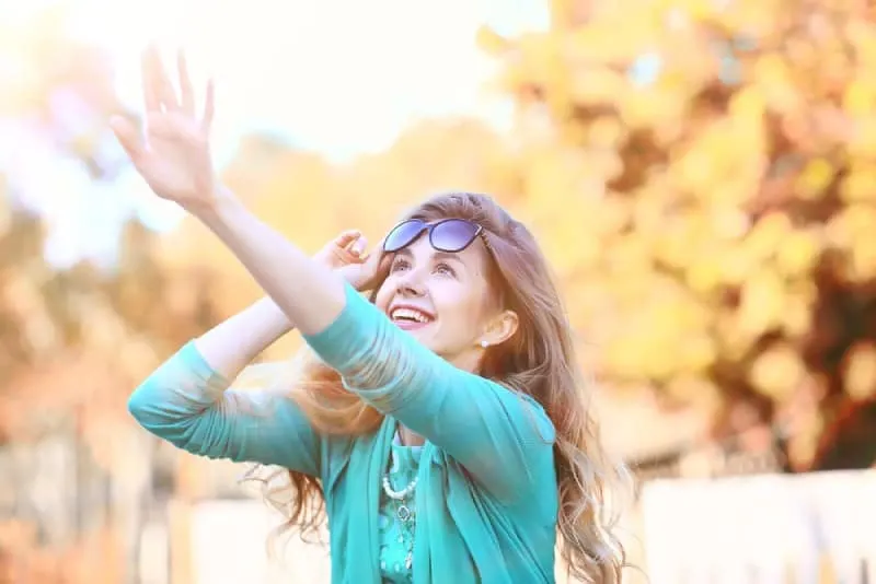 happy young woman outside on autumn
