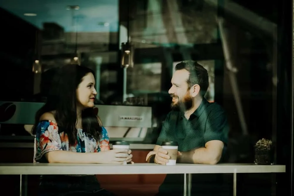 couple is having a serious conversation in coffee shop