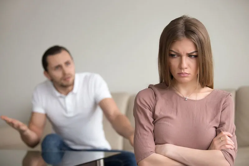 man arguing with angry woman