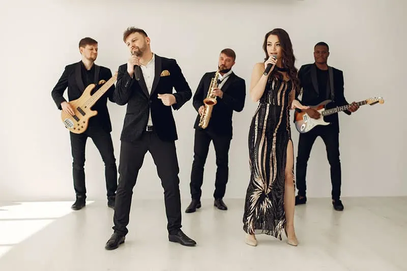 people-live-performing in black suits and white background