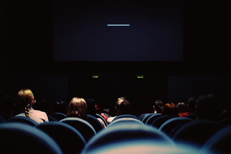 people sitting on chair in the cinema