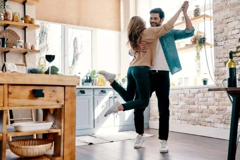 romantic couple dancing in the kitchen