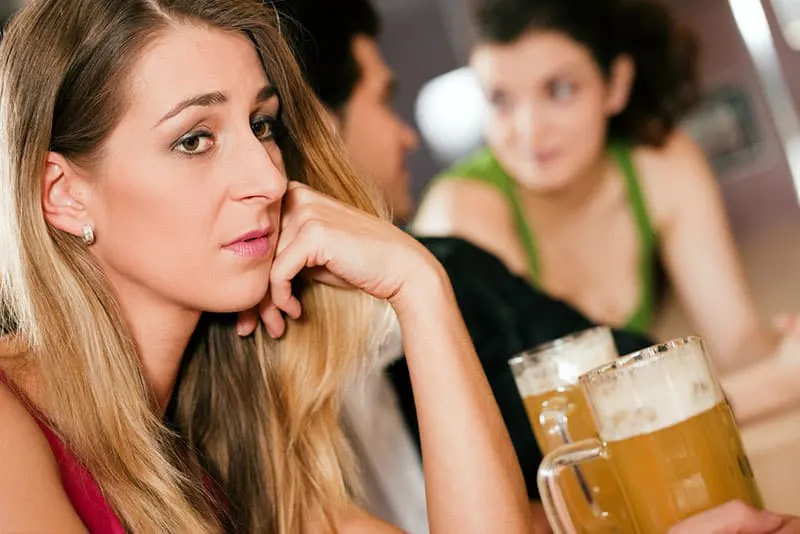 sad young woman in bar