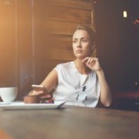 pensive woman dreaming about something