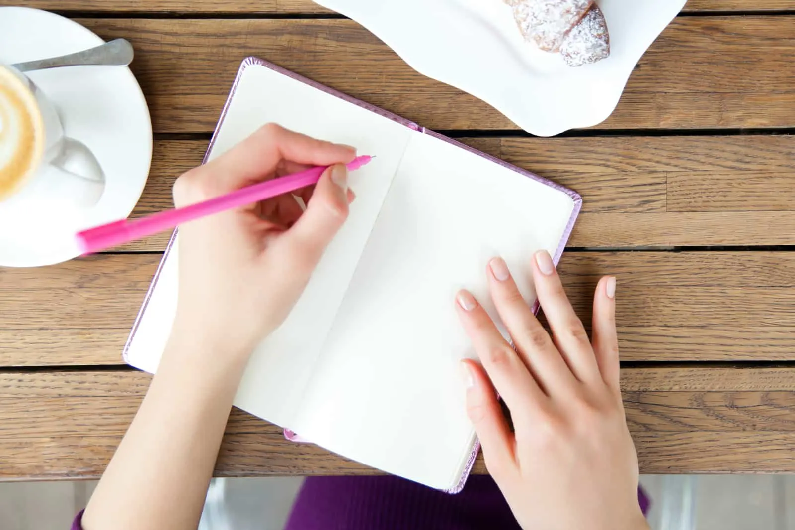 the woman sits and writes