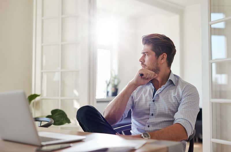 thoughtful man sitting in the office