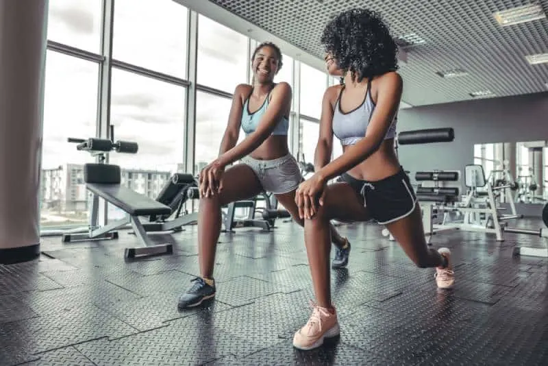 two girls working out at gym