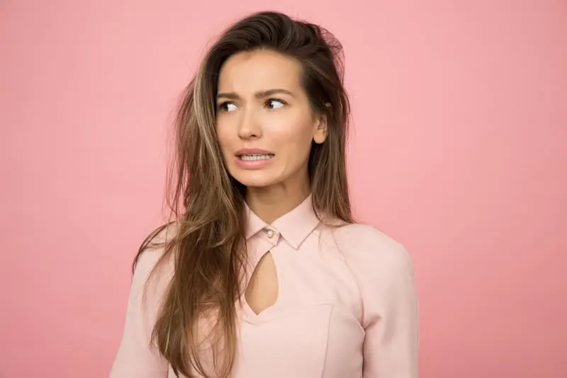 woman wearing pink with pink wall
