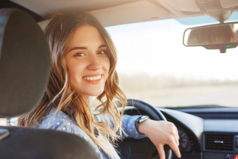happy girl driving alone
