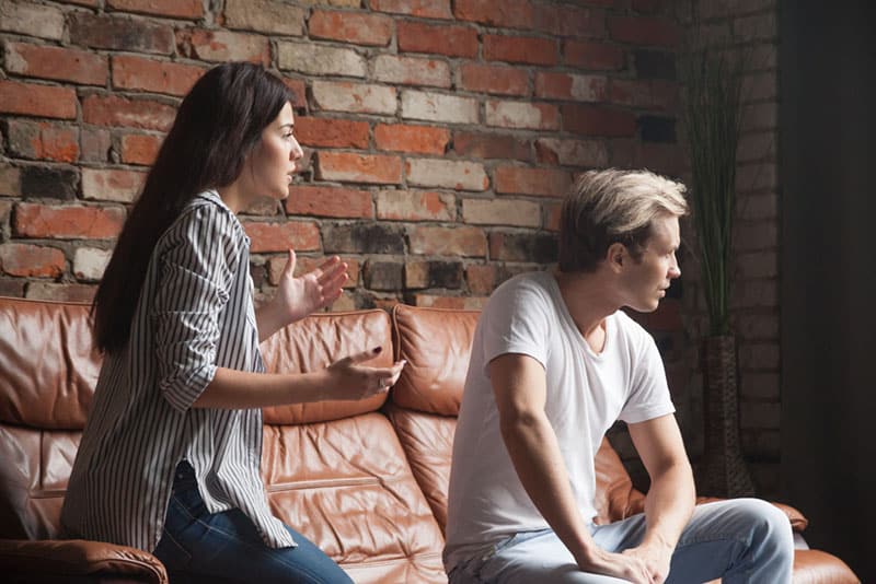 young woman apologizing to her boyfriend