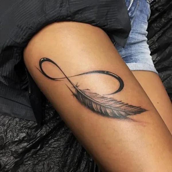 realistic 3D feather design tattoo on arm