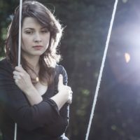 a woman sitting on a swing