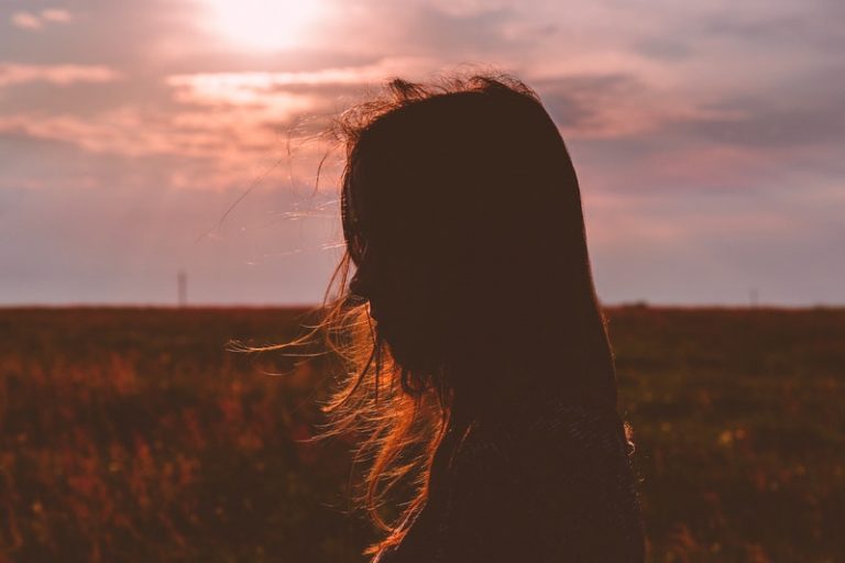 woman's silhouette during sunset