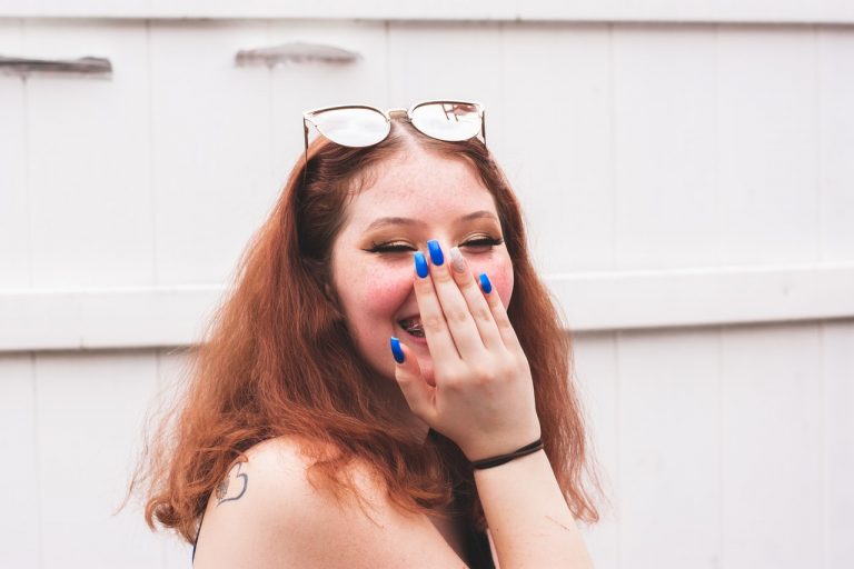 woman touching her nose with hand