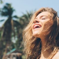 happy woman breathing with full lungs