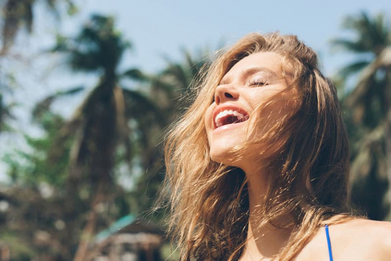 happy woman breathing with full lungs