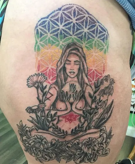 Meditating woman tattoo with colors