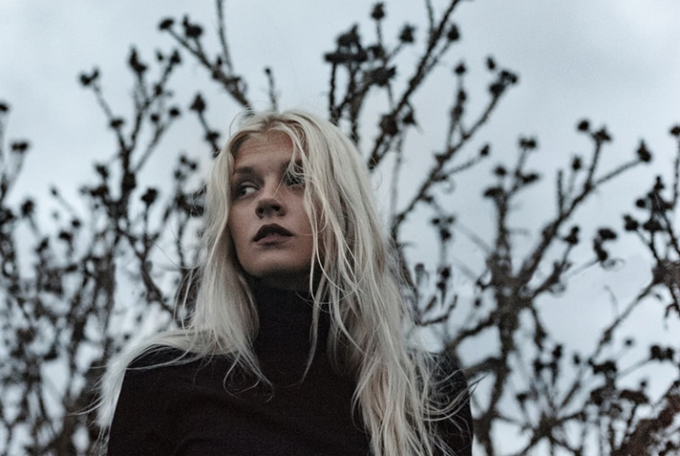 woman wearing black turtleneck sweater
