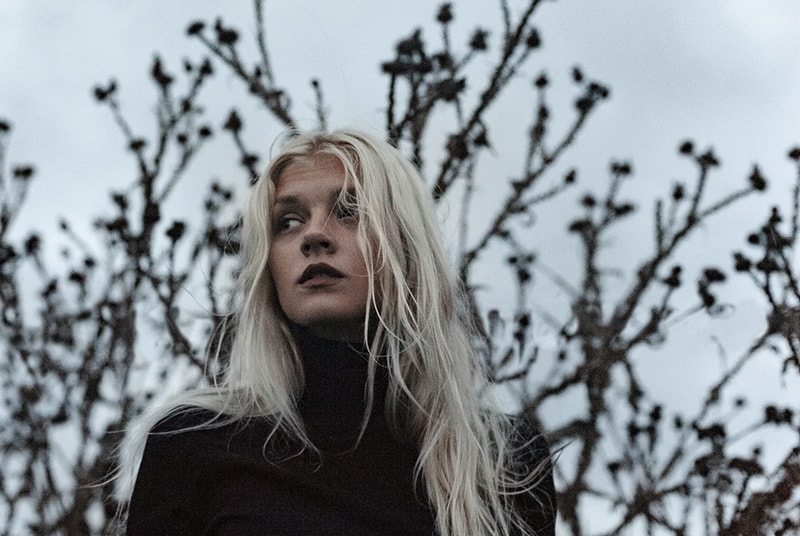 woman wearing black turtleneck sweater