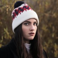 woman in white beanie standing outdoor