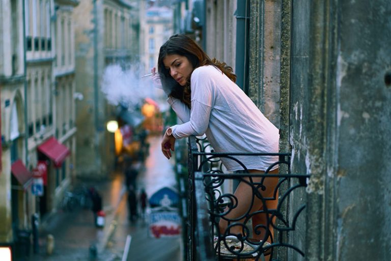 woman smoking on the balcony