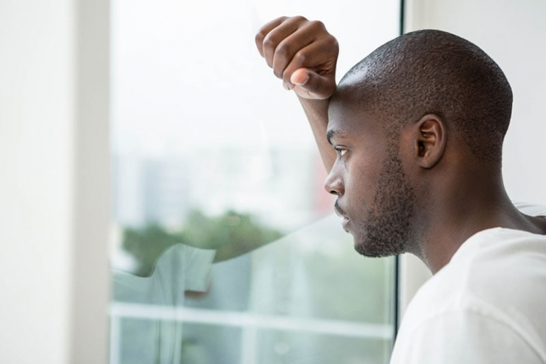 serious man looking through the window