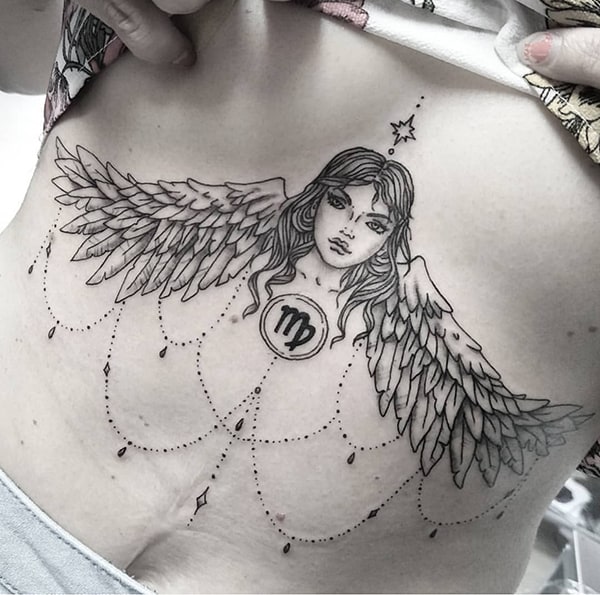 Virgo symbol with angel and crystals tattoo on the sternum