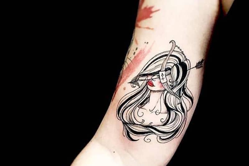 archery girl tattoo on the arm