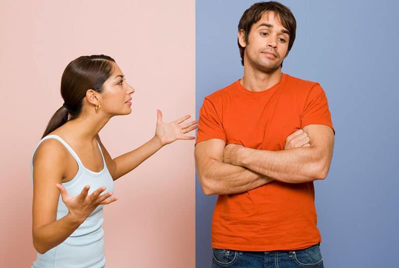 arguing man and woman in pink and blue wall background