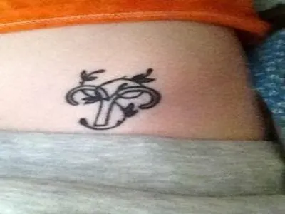 Aries in a wreath tattoo on back