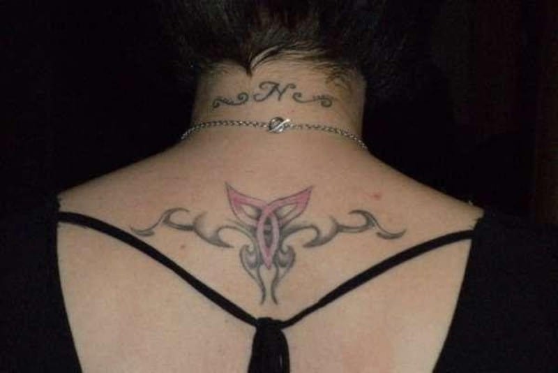 aries tribal tattoo on the upper back