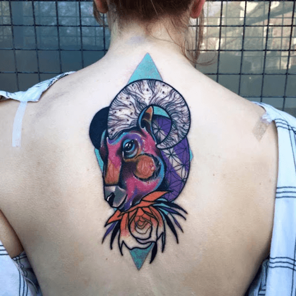 colorful aries watercolor tattoo on back