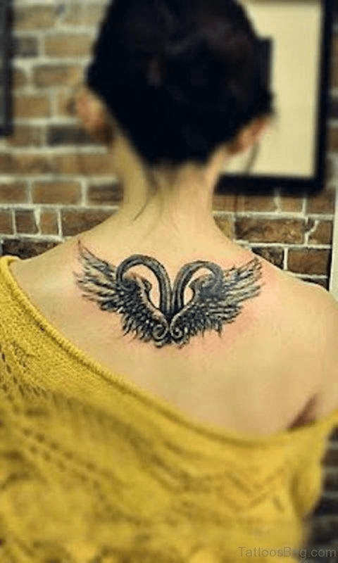 Aries with wings tattoo on the upper back