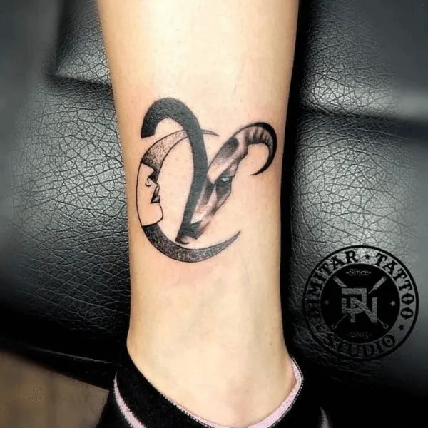 aries zodiac symbol with a crescent moon ankle tattoo