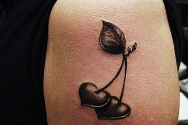 black hearts tattoo on arm