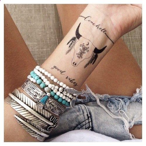 boho skull tattoo on the wrist