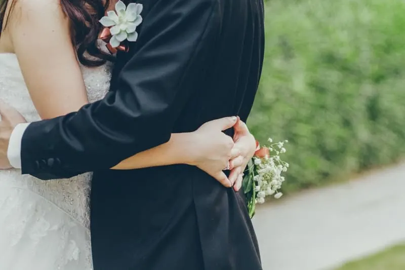 bride and groom hugging focused on the body