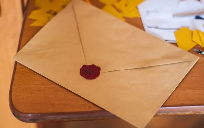brown envelope on table sealed with red seal