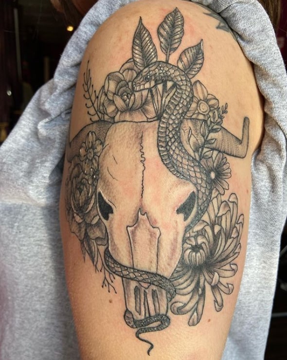 bull and snake tattoo on the shoulder