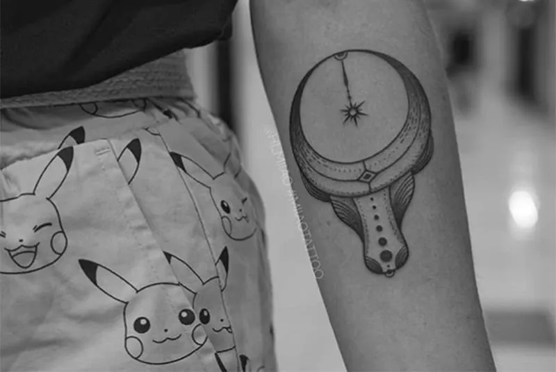 circular horns tattoo on the arm