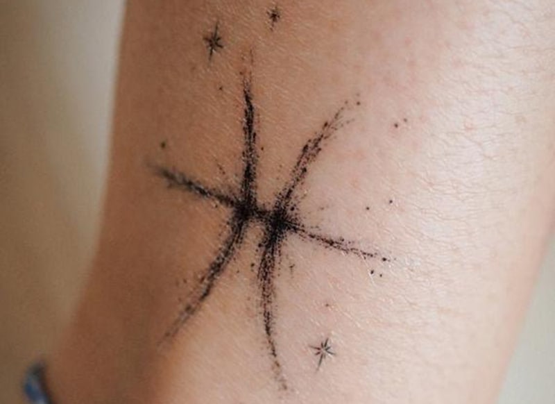 classical pisces symbol tattoo decorated with stars