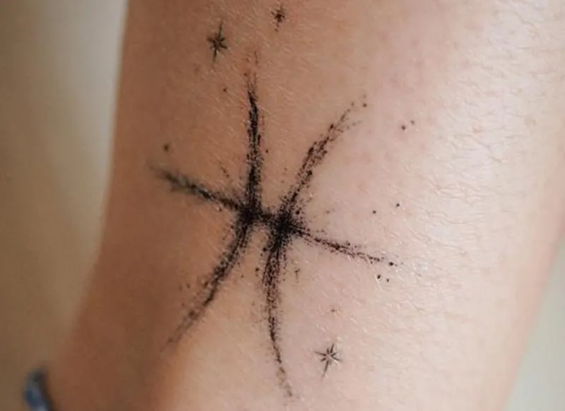 classical pisces symbol tattoo decorated with stars