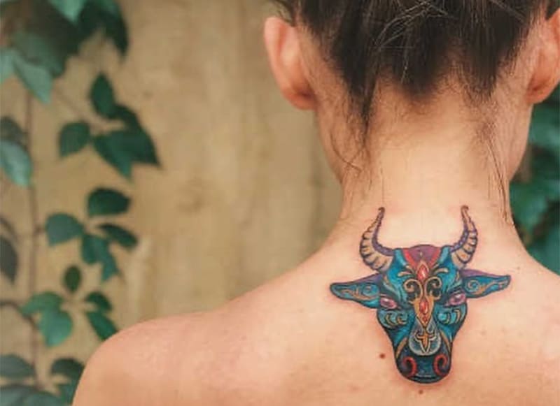 colorful taturus tattoo on the back